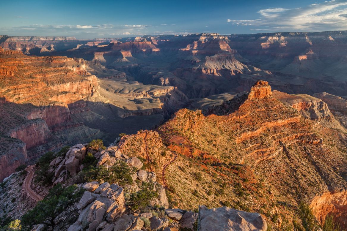 The South Kaibab Trail drops to the Colorado River in the bottom of the Grand Canyon in just under seven miles. Numerous day hike options turn around at phenomenal viewpoints if you don't want to commit to an overnight trip to the bottom of the canyon.