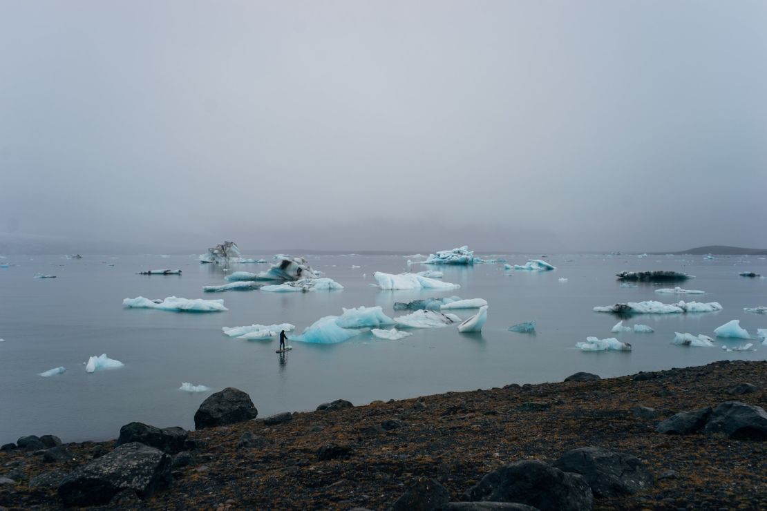 Sean Yoro navigates remote locations on a paddle board to find the right pieces of ice for his art