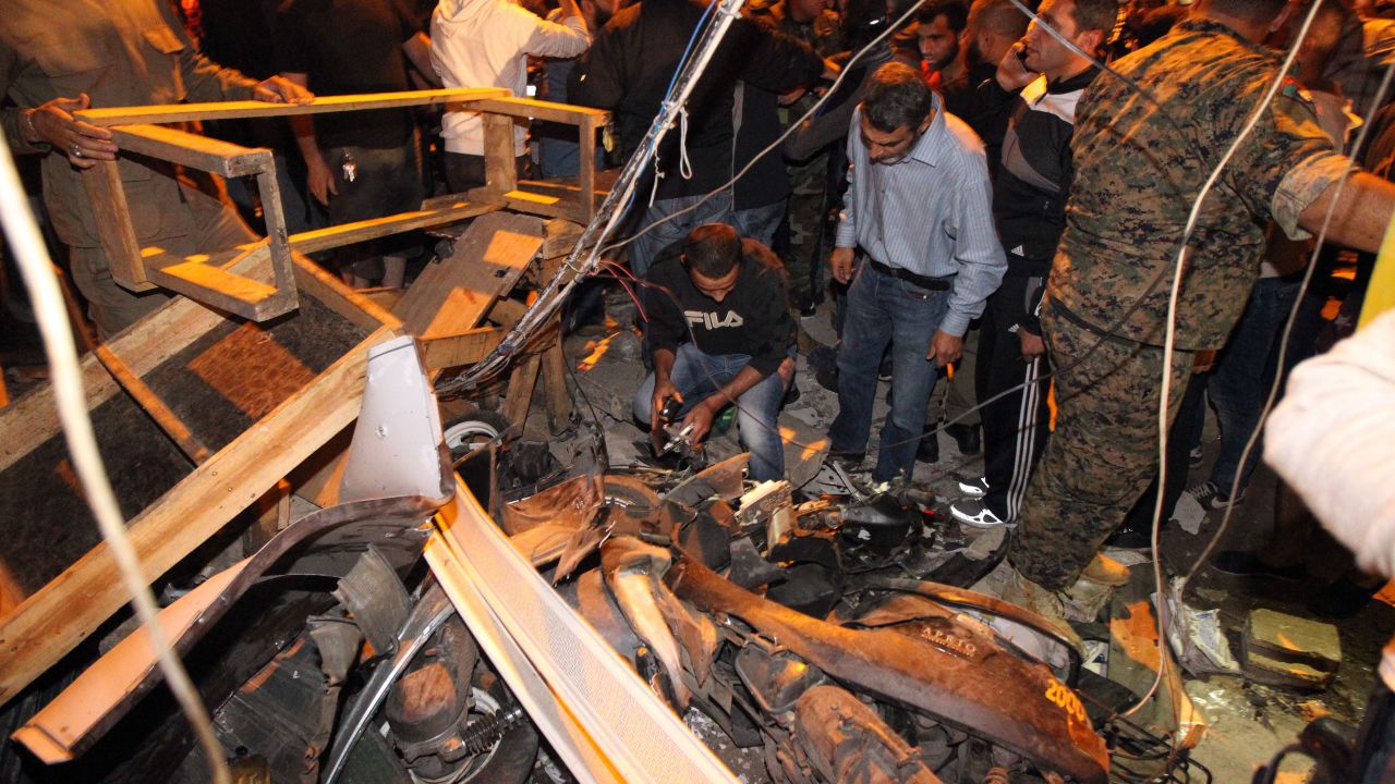 Emergency personnel inspect the debris at the site of the bombing. The blasts shook Bourj al-Barajneh, one of the biggest and most well-known refugee camps in Lebanon, according to the state-run National News Agency. The camp is mostly populated by Palestinians.