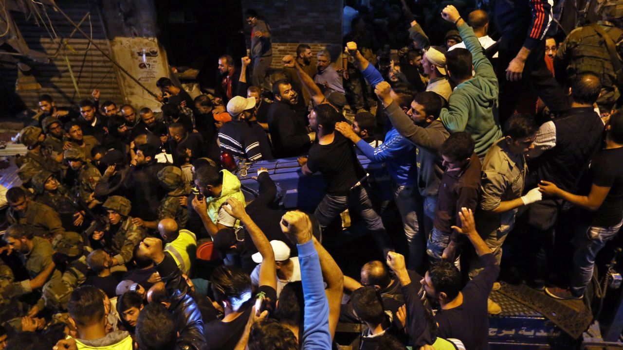 Civilians chant at the site of the twin suicide attack.