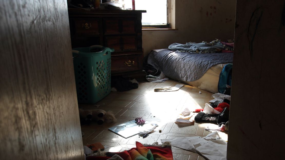 Willamette Rising Sun's home in Lame Deer, Montana, doesn't have electricity. The family has huddled together in this room for warmth.