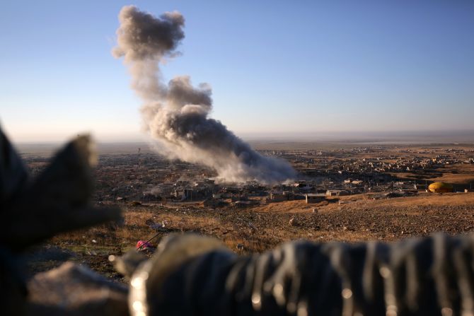 Smoke rises over the northern Iraqi town of Sinjar on November 12. Kurdish Iraqi fighters, backed by a U.S.-led air campaign, <a href="index.php?page=&url=http%3A%2F%2Fwww.cnn.com%2F2015%2F11%2F13%2Fmiddleeast%2Firaq-free-sinjar-isis%2F" target="_blank">retook the strategic town, </a>which ISIS militants overran last year. ISIS wants to create an Islamic state across Sunni areas of Iraq and Syria.