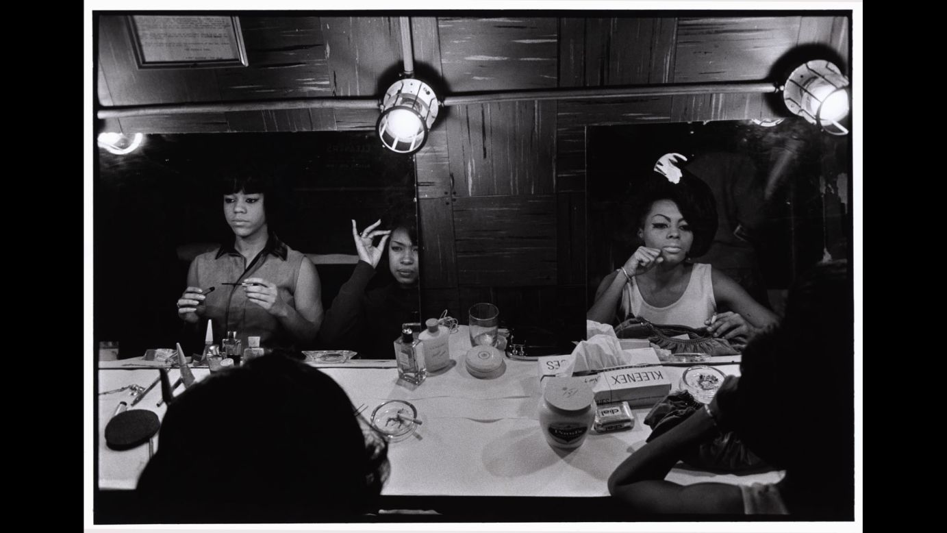 The Supremes prepare for a show at New York's Apollo Theater in 1965. The singing group had several hit songs that year, including "Stop! In the Name of Love," "Back in My Arms Again" and "I Hear a Symphony." Bruce Davidson photographed the Supremes in New York and Detroit. "I was able to come close and personal because somehow they trusted my eye," he said 50 years later. "They allowed me, with my little Leica camera, to photograph. ... Whether it was performing, whether it was looking at themselves in the backstage mirror or whether it was resting between performances, sitting on a bed, I was allowed and no one closed any doors."