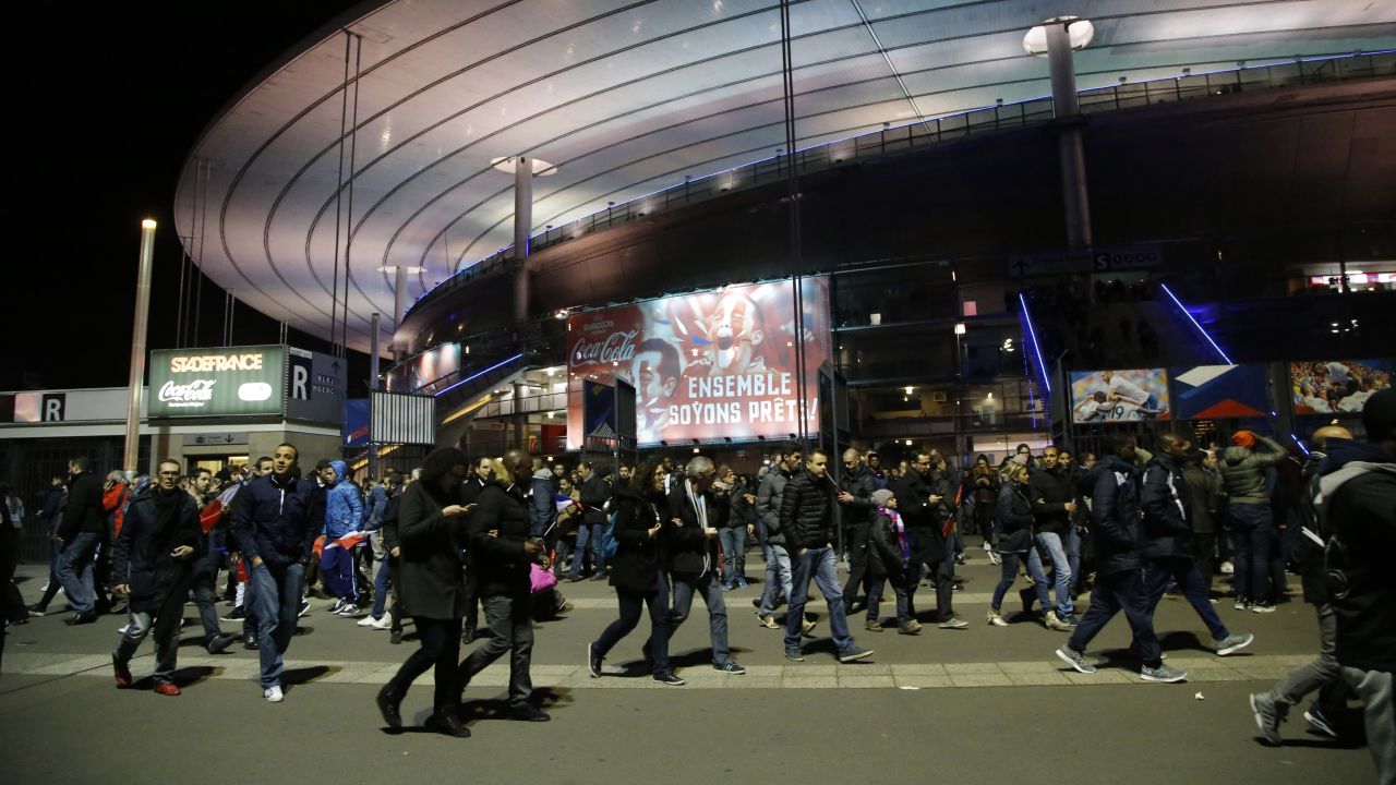 People leave the Stade de France after explosions were heard near the stadium during a  soccer match between France and Germany on Friday. Paris Deputy Mayor Patrick Klugman told CNN President Francois Hollande was at the match and was evacuated at halftime.