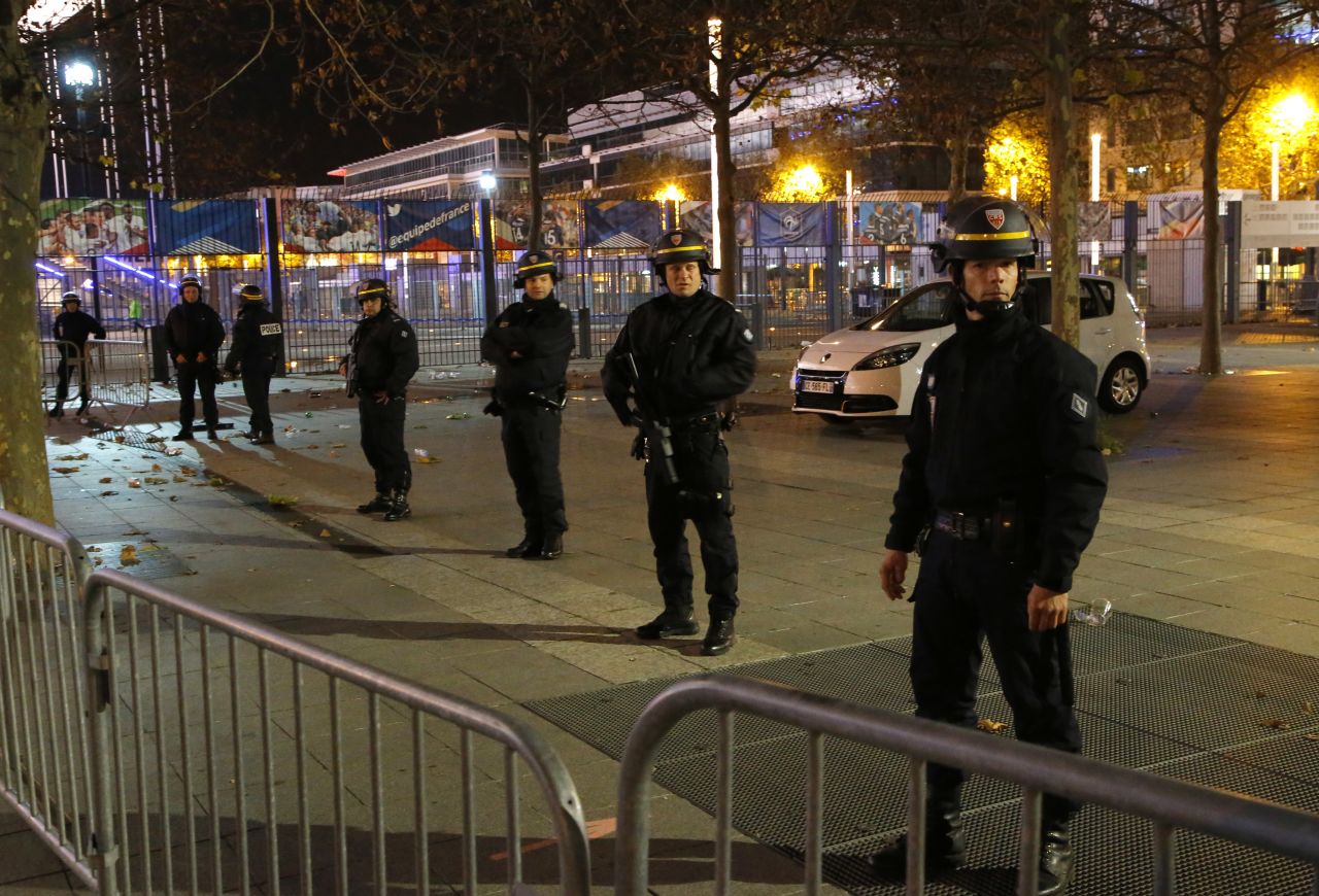 Police secure the Stade de France in Saint-Denis, north of Paris, following explosions during the soccer match between France and Germany.