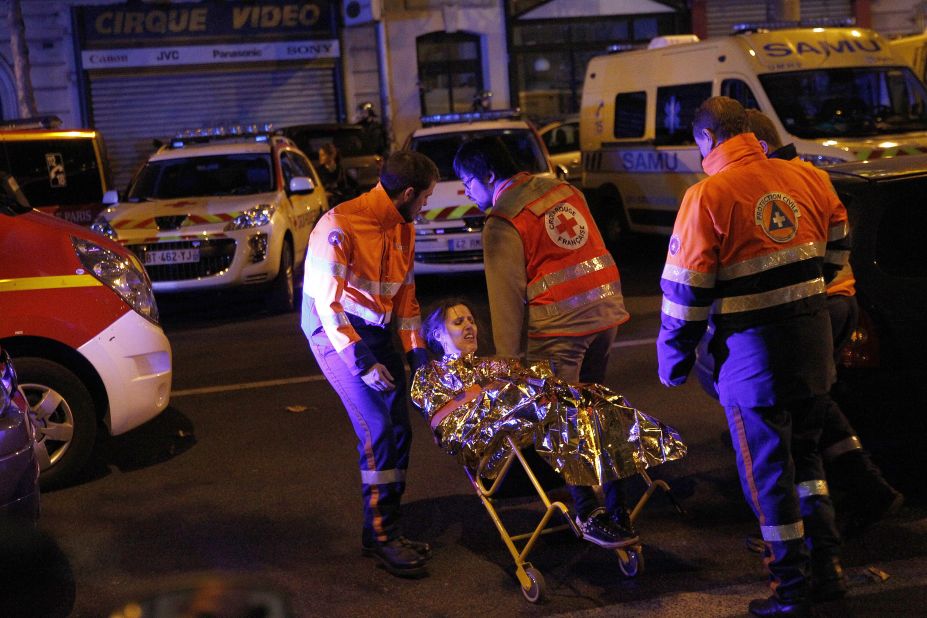 Medics evacuate an injured woman on Boulevard des Filles du Calvaire near the Bataclan early on November 14.