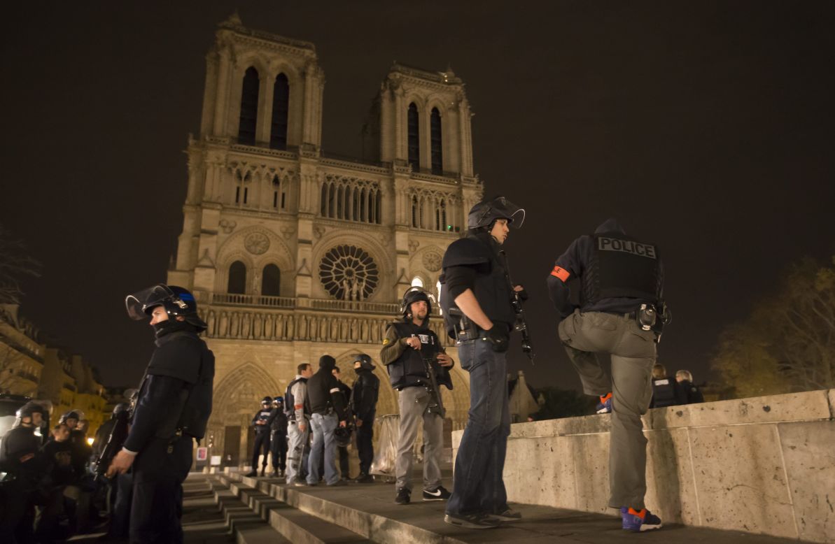 Police officers patrol the area around Notre Dame cathedral in Paris on November 14. 