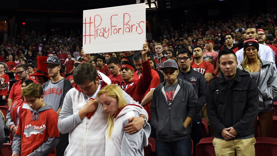 University of Nevada, Las Vegas, fans observe a moment of silence for the victims of the terrorist attacks in Paris before a basketball game November 13.