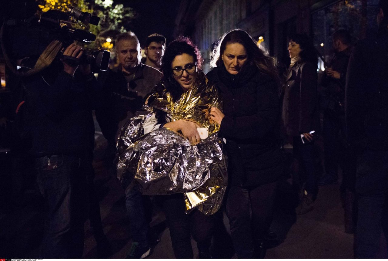 A survivor of the terrorist attack in the Bataclan is assisted following terror attacks, November 13. The violence at the Bataclan, which involved a hostage-taking, resulted in the highest number of casualties of all the attacks.