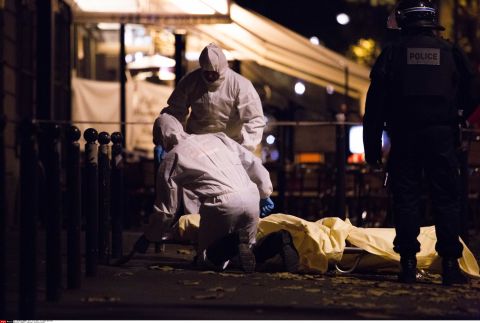 Forensics are working in the street of Paris after the terrorist attack on Friday, November 13.  The words "horror," "massacre" and "war" peppered the front pages of the country's newspapers, conveying the shell-shocked mood.  