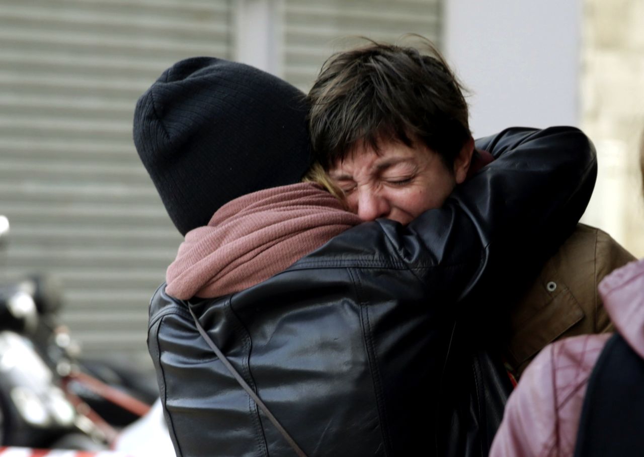 Mourners gather outside Le Carillon bar in the 10th district of Paris on November 14. "We were listening to music when we heard what we thought were the sounds of firecrackers," a doctor from a nearby hospital who was drinking in the bar with colleagues told Le Monde. "A few moments later, it was a scene straight out of a war. Blood everywhere."