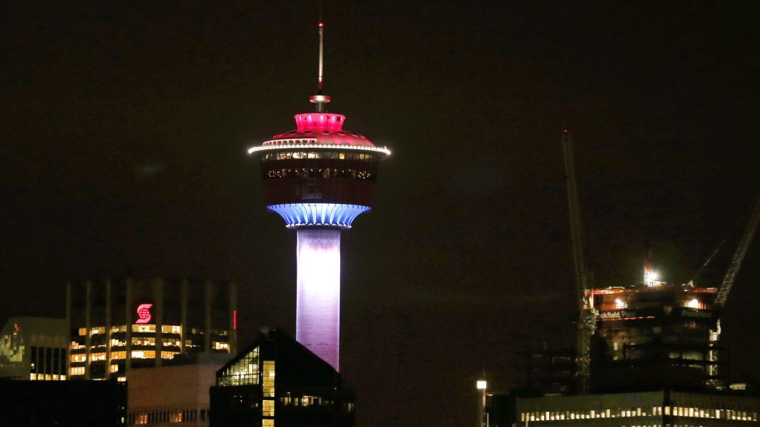 The Calgary Tower in Alberta, Canada, is lit up with the colors of the French flag on Friday, November 13.