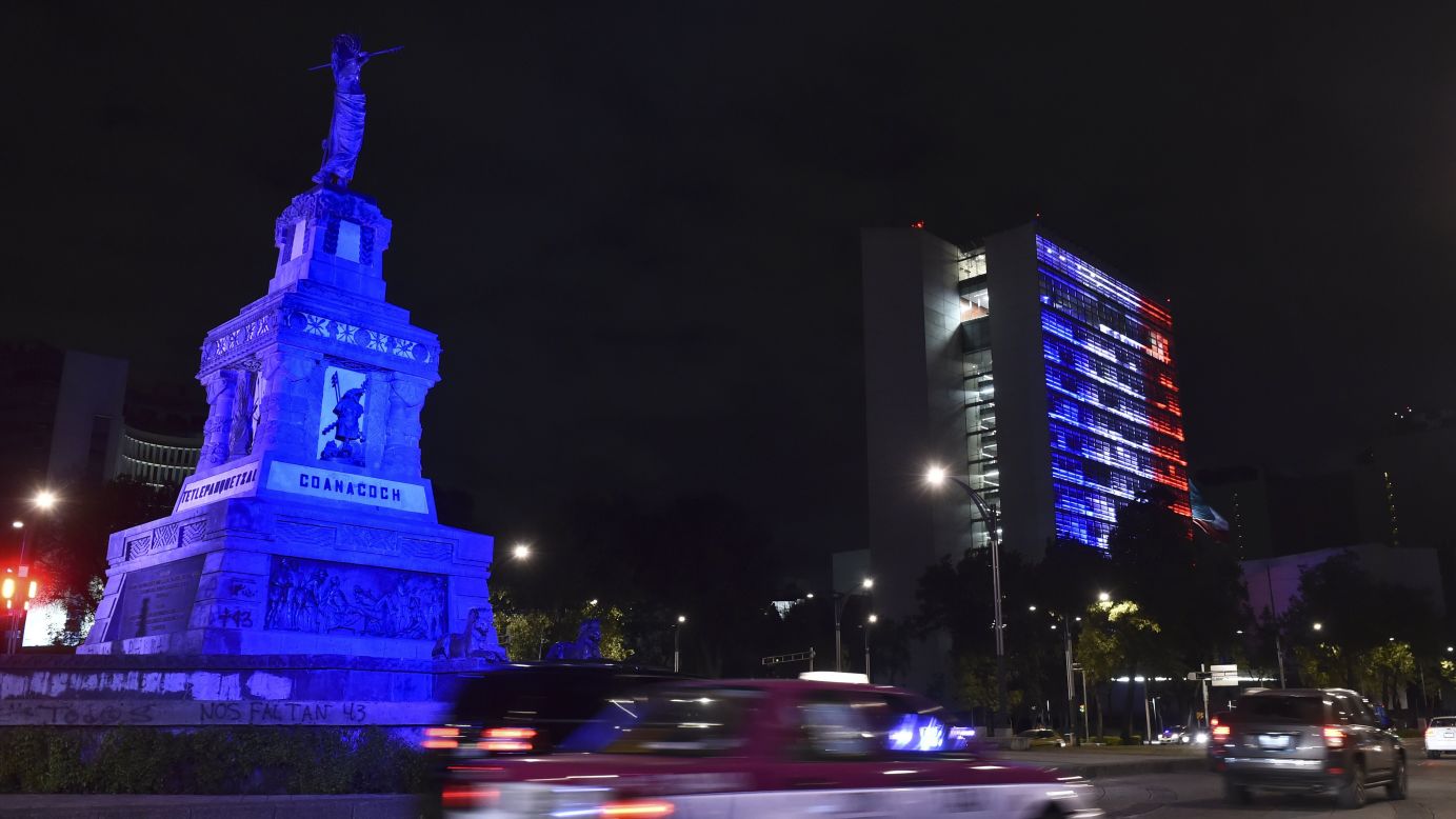 The Senate building in Mexico City is lit up blue, white and red on November 13.