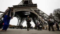 French soldiers patrol the area at the foot of the Eiffel Tower in Paris on November 14, 2015 following a series of coordinated attacks in and around Paris late Friday.