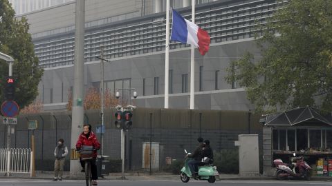 The French national flag flutters at half-staff on November 14 at its embassy in Beijing.