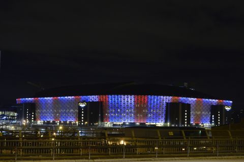 Friends Arena in Solna, Sweden, is illuminated in blue, white and red on November 14.