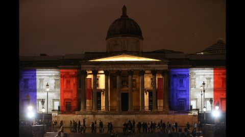 London's National Gallery is illuminated in blue, white and red lights on November 14.