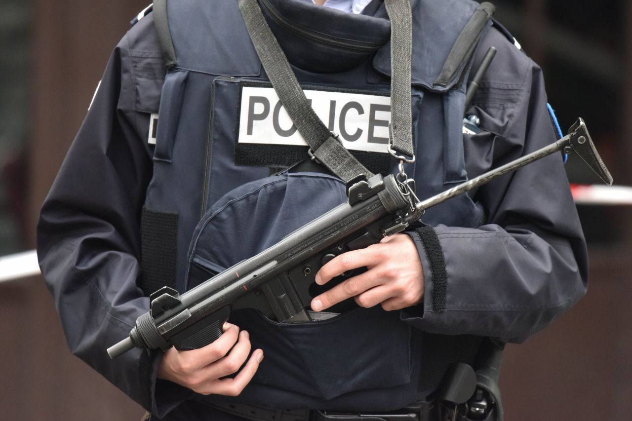 A police officer stands guard outside the Cafe Bonne Biere in the Rue de la Fontaine au Roi in Paris on November 14. 