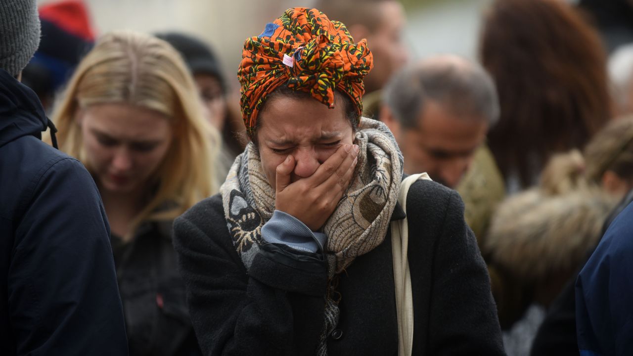 A woman weeps in Paris on November 14, the day after a series of deadly attacks in the French capital. 