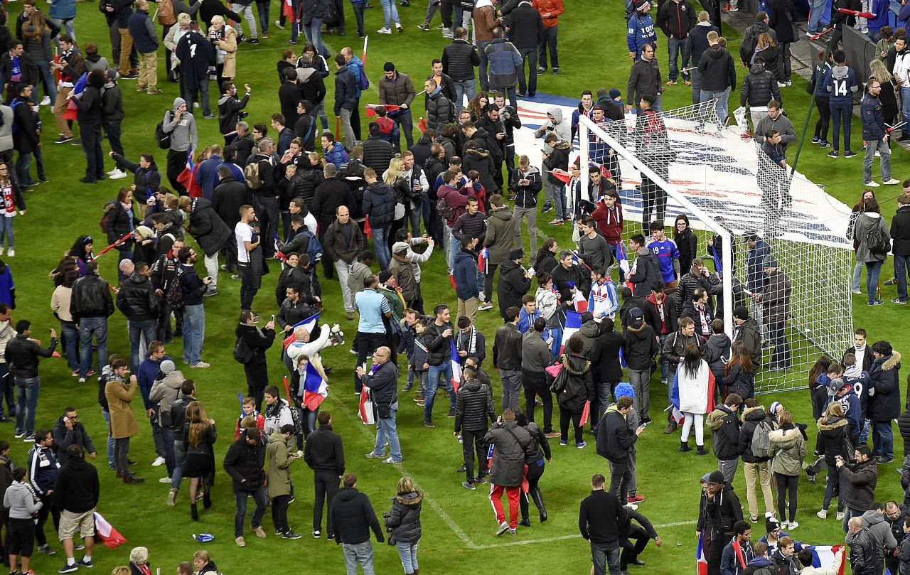 Fans at the France - Germany match were gathered on the pitch in the aftermath of explosions near the Stade de France. The match, won 2-0 by France, had been completed but people were held in the stadium for security reasons.