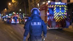 An elite police officer arrivesoutside the Bataclan theater  in Paris, France, Wednesday, Nov. 13, 2015. Several dozen people were killed in a series of unprecedented attacks around Paris on Friday, French President Francois Hollande said, announcing that he was closing the country's borders and declaring a state of emergency. (AP Photo/Kamil Zihnioglu)