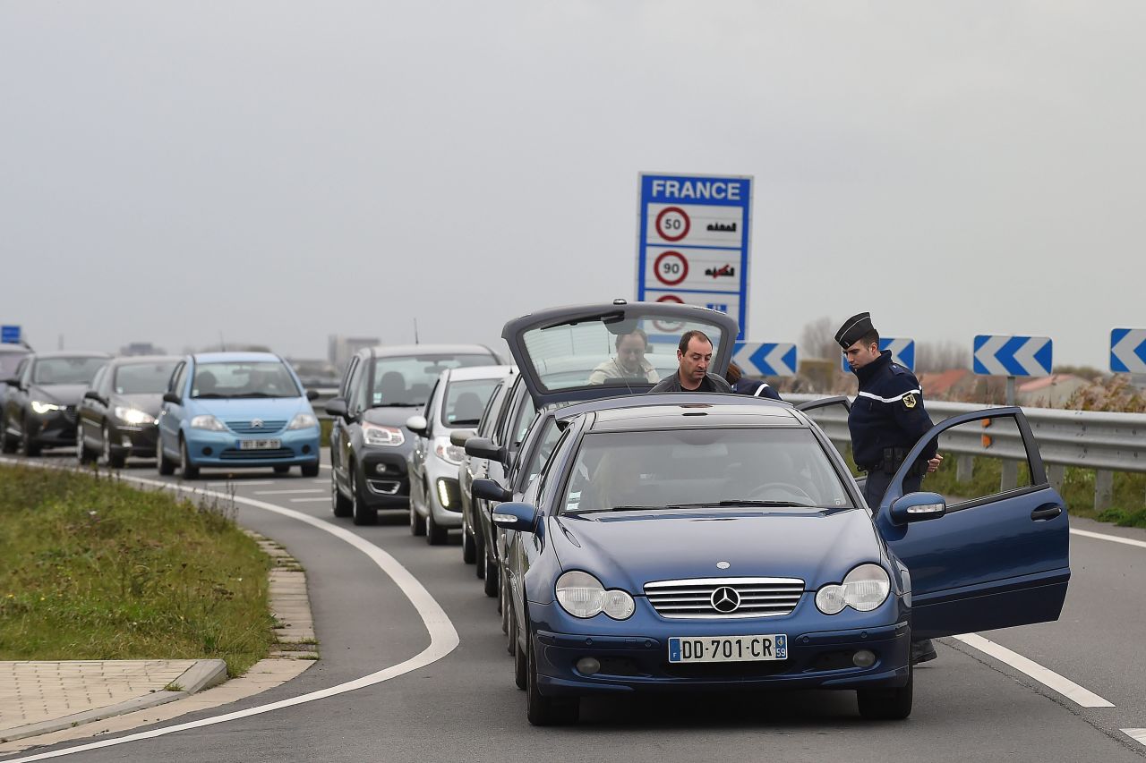 Security personnel inspect vehicles at the border between Belgium and France on Saturday, November 14.