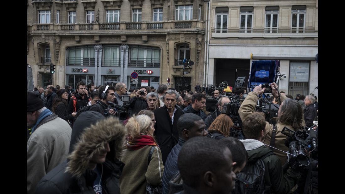 Bernard-Henri Levy, a prominent French philosopher, stands in the center of a crowd near the Bataclan on November 14.