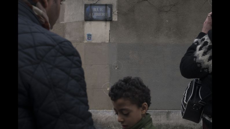 Bullet holes are circled on a wall near Le Petit Cambodge on November 14.