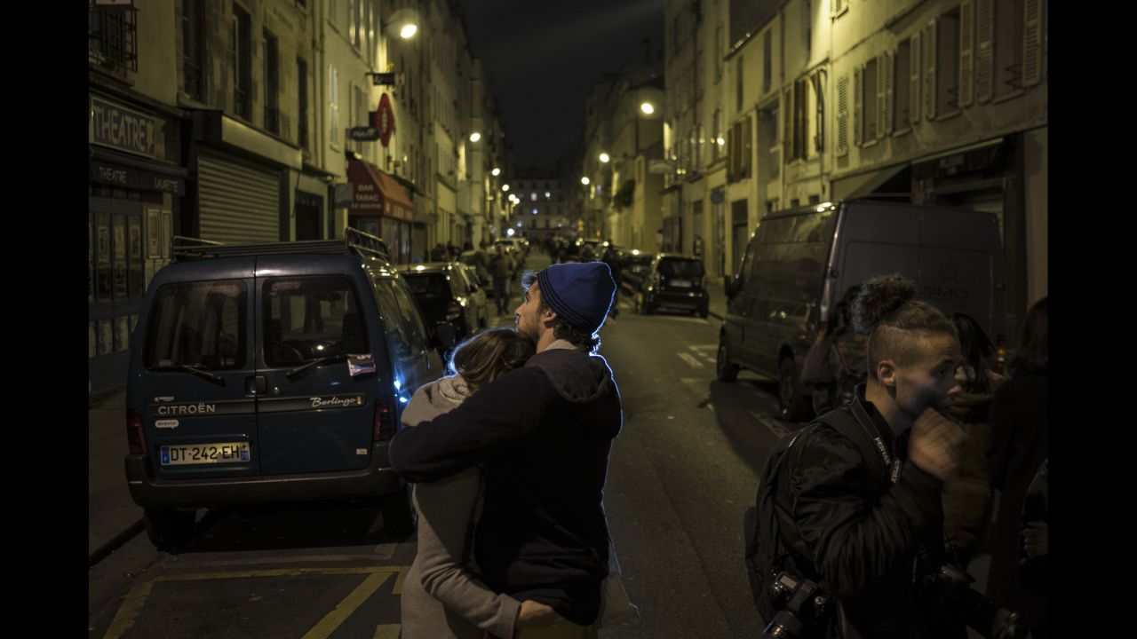 A couple embraces in the streets of Paris on November 14. The world has rallied around France.