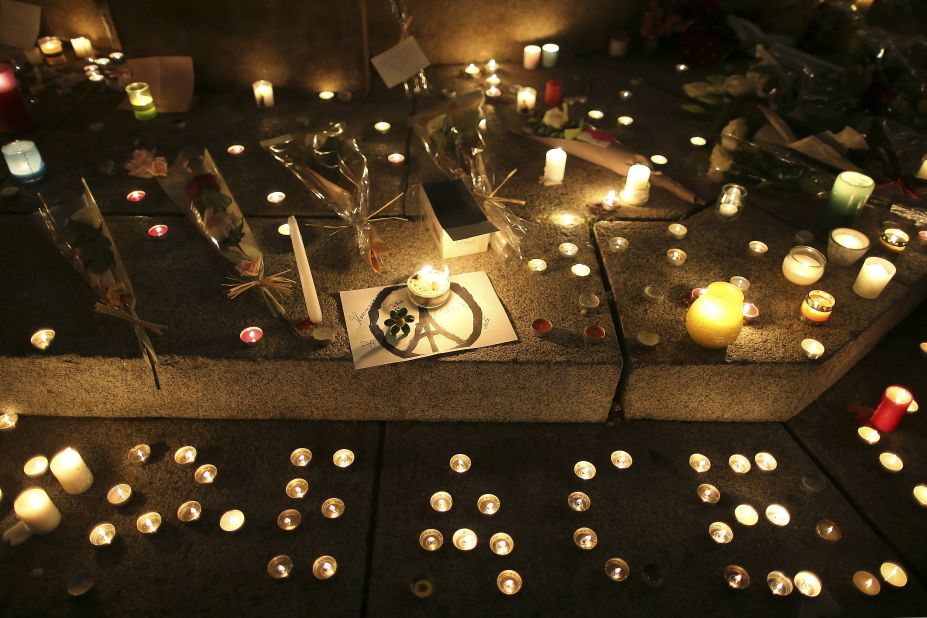 Candles read "peace" at a temporary memorial for the victims of the Paris attacks in Rennes, western France.