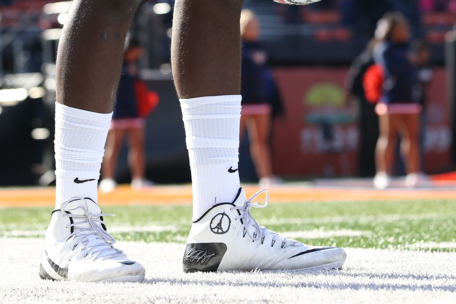 Ohio State Buckeyes quarterback Cardale Jones is shown wearing a Paris peace symbol drawn on his cleat during the first half of an NCAA football game against the Illinois Fighting Illini in Champaign, Illinois. 