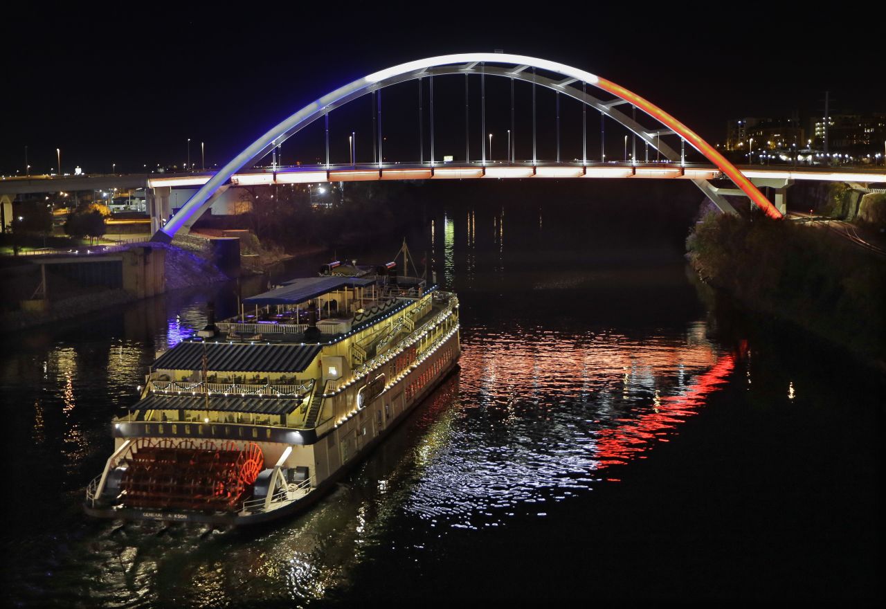 A paddlewheel riverboat passes under a bridge in Nashville, Tennessee, on Saturday, November 14.