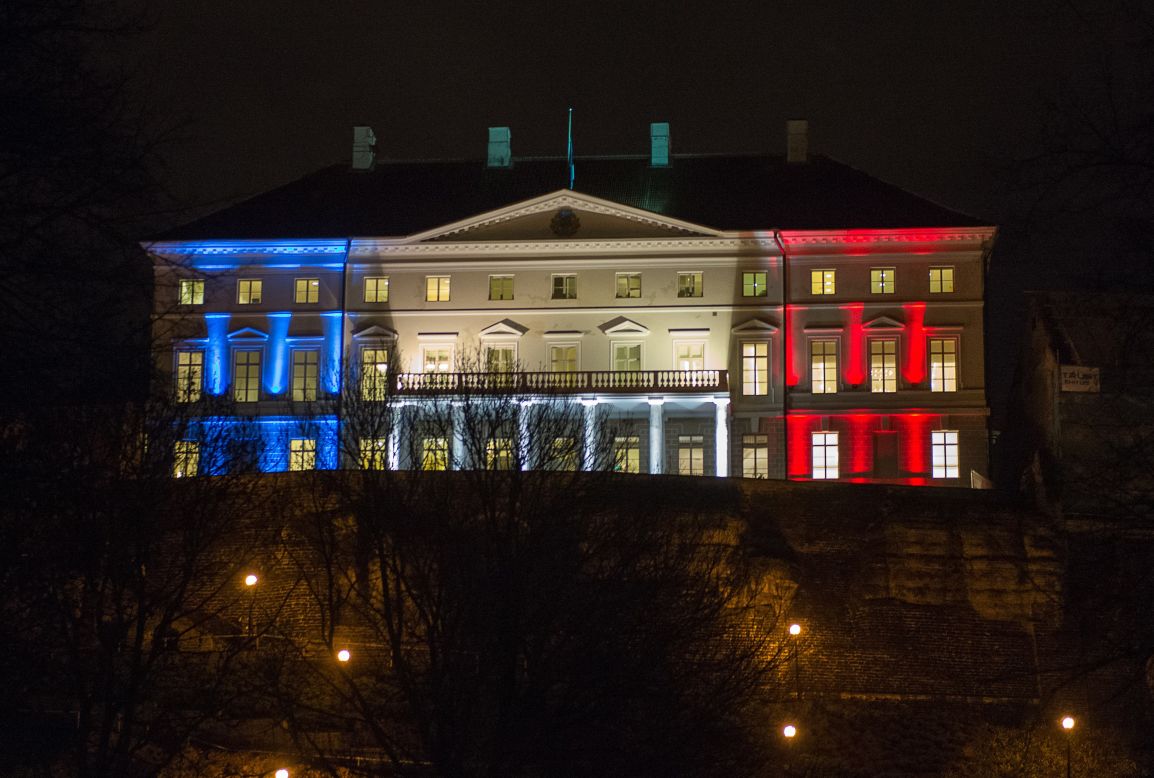 Estonia's government building in Tallinn glows with the French national colors on November 14.