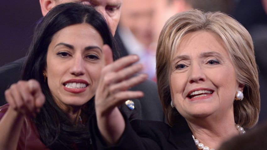 Democratic Presidential hopeful Hillary Clinton (R)  gestures next to Huma Abedin after the second Democratic presidential primary debate in the Sheslow Auditorium of Drake University on November 14, 2015 in Des Moines, Iowa.