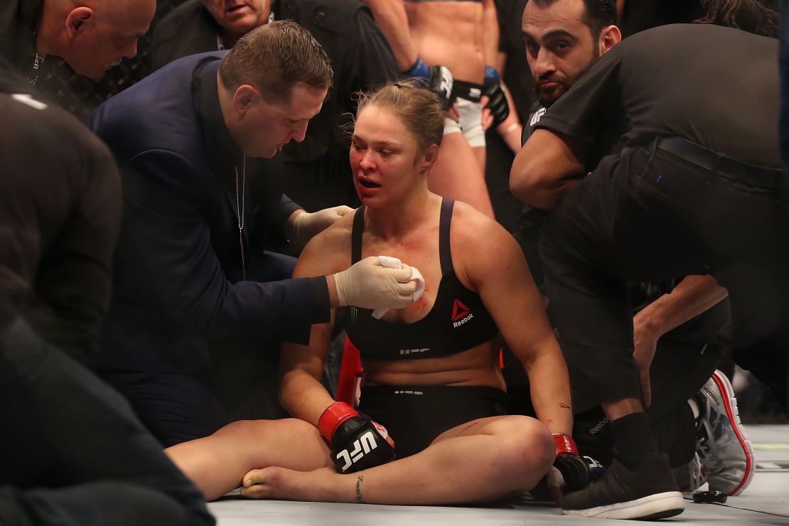 Rousey receives medical treatment after being knocked cold by Holly Holm.