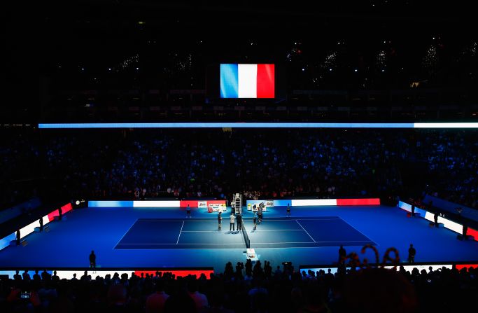 The O2 arena in London is illuminated with the red, white and blue of the French flag as a mark of respect to the victims of Friday's terror attacks in Paris. The venue is currently  hosting the ATP World Tour Finals tennis tournament.