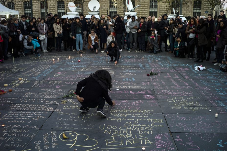 People write messages on the ground at Place de la Republique in Paris on November 15. 