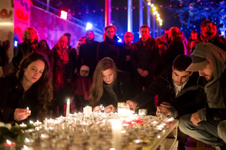 People light candles in tribute to the Paris victims on November 15 in Budapest, Hungary.  