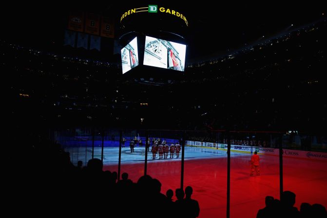The sentiment was just as strong in North America. Here, Boston Bruins and Detroit Red Wings ice hockey teams pause for a moment of silence before their game at the TD Garden.
