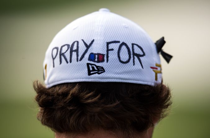 Benjamin Herbert of France wears a cap which reads "pray for Paris"  to commemorate the victims of Friday's attacks in the French capital during the Shanghai Masters golf tournament. The world of sport was united in sending a message of solidarity to Paris in its hour of need this weekend.