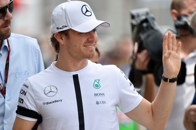 Mercedes' German Formula One driver Nico Rosberg arrives in the paddock at the Brazilian Grand Prix wearing a black armband in tribute to the victims of the Paris attacks.