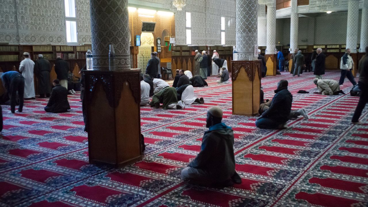 Men pray at the Courcouronnes mosque (Mosquee Evry Courcouronnes).