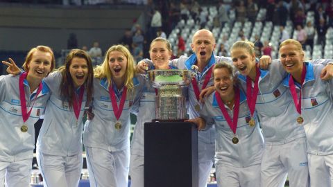 The Czech Republic's Fed Cup team players pose with the trophy after their triumph over Russia in Prague.