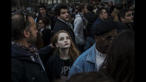 A crowd gathers on Rue Charonne on November 15 near the site of one of the attacks.