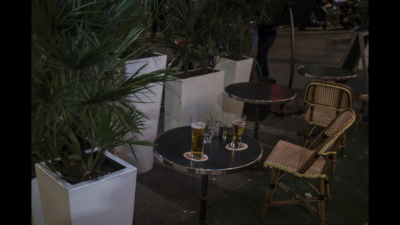 Drinks sit abandoned on a cafe terrace near Place de la République after a false alarm caused a panic on November 15.