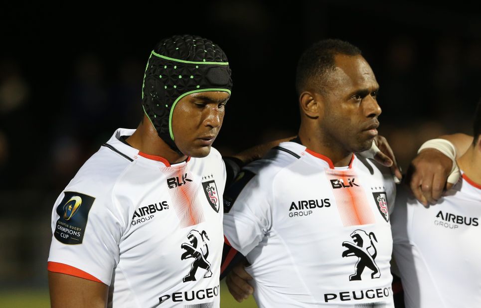 An emotional Toulouse and France rugby captain Thierry Dusautoir (L) lines up with his team for a minutes silence during the European Rugby Champions Cup match between Saracens and Toulouse at the Allianz Stadium in Barnet, England.