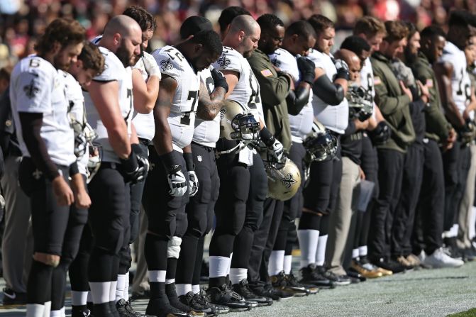 New Orleans Saints players fall silent before playing the Washington Redskins at FedExField, Maryland.