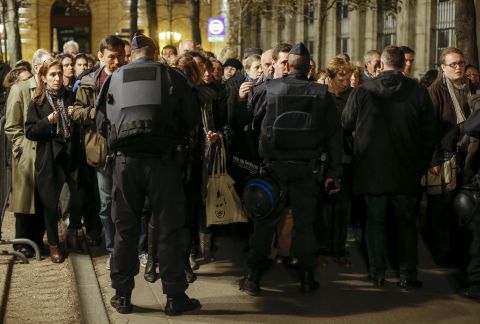 People go through a security checkpoint to attend a Mass in homage to victims of the Paris terror attacks at Notre Dame cathedral in Paris on Sunday, November 15. French President Francois Hollande declared a state of emergency after the attacks in Paris on Friday, November 13, and said border security has been ramped up. The terrorist group ISIS claimed responsibility for the attacks. 