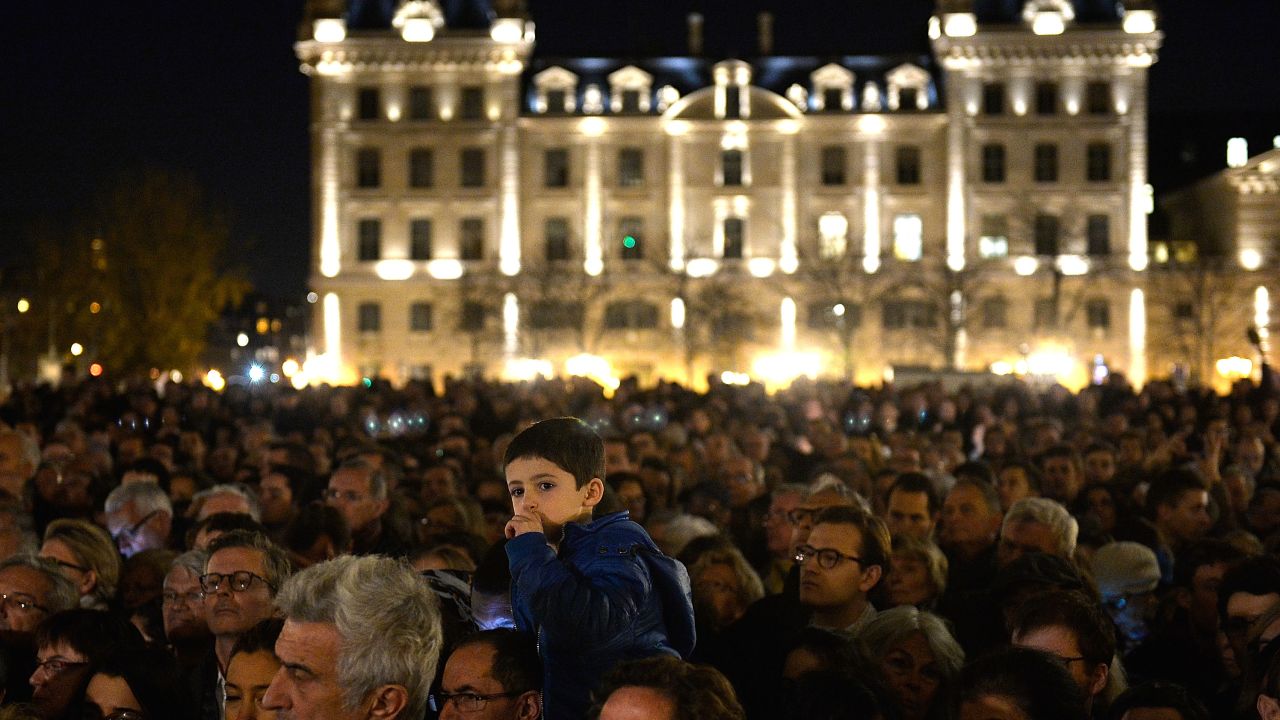 PARIS, FRANCE - NOVEMBER 15:  People gather outside Notre Dame Cathedral ahead of a ceremony to the victims of the Friday's terrorist attacks on November 15, 2015 in Paris, France. As France observes three days of national mourning members of the public continue to pay tribute to the victims of Friday's deadly attacks. A special service for the families of the victims and survivors is to be held at Paris.'  (Photo by Pascal Le Segretain/Getty Images)
