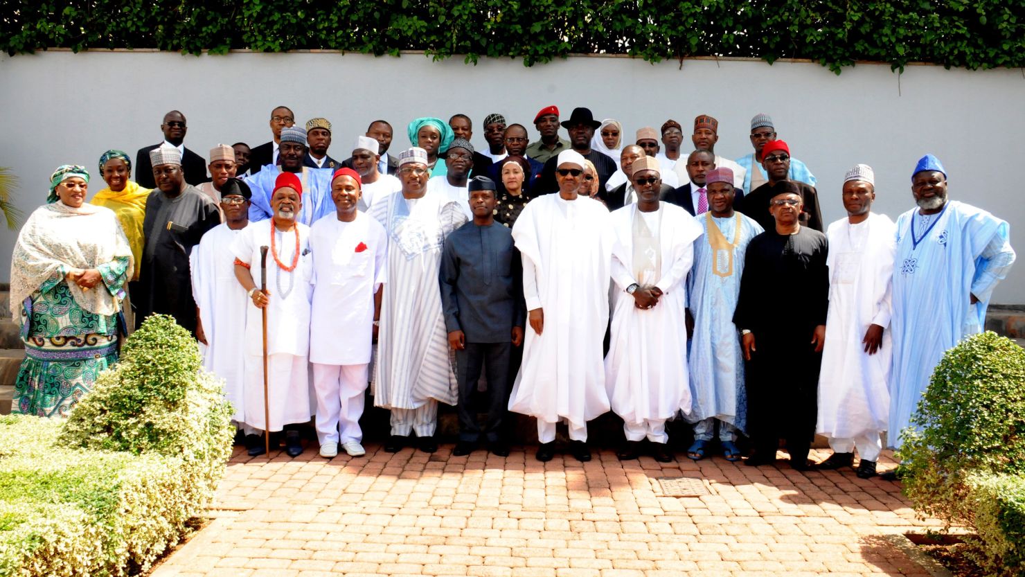 Nigerian President Mohammadu Buhari poses for a family photo with newly-appointed ministers after the swearing in ceremony in Abuja.